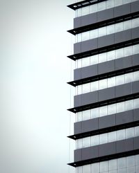 Low angle view of modern building against clear sky