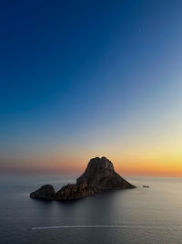 Scenic view of sea against clear sky during sunset