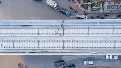 High angle view of workers working over bridge