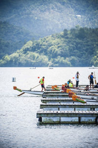 People rowing boats at dragon boat festival