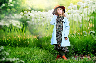 Girl standing on field