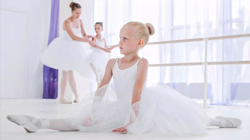 Girl practicing ballet in studio