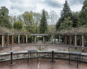 Gazebo by trees against sky