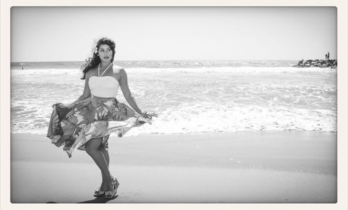 Woman standing on beach