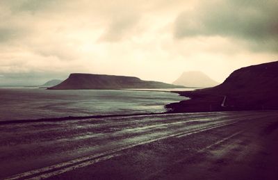 Scenic view of sea against cloudy sky