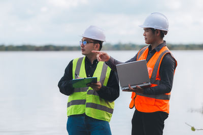 Rear view of man standing against sky