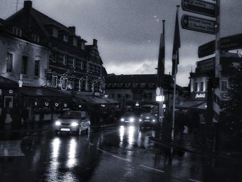 Cars on road in rain at night