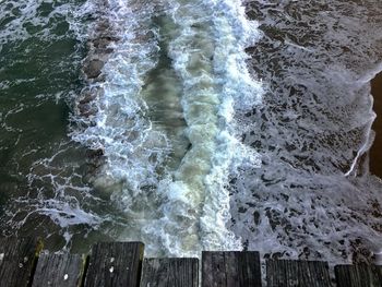 High angle view of waves on beach