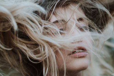 Close-up of woman with tousled hair