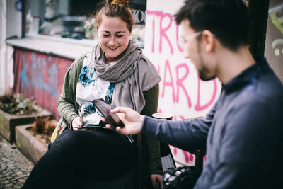Young couple looking at camera