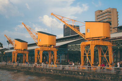 View of pier by river against sky