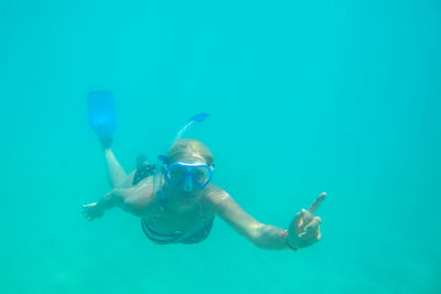 Portrait of woman snorkeling in sea