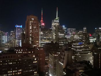 Illuminated buildings in city at night