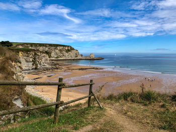 Scenic view of beach against sky