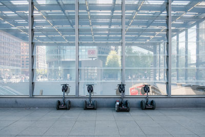 Reflection of people on glass window in building