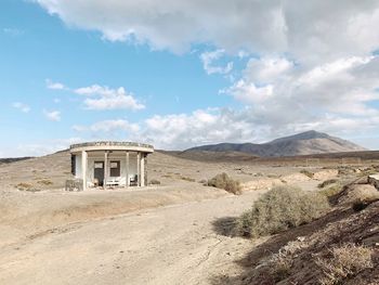 Built structure on land against sky