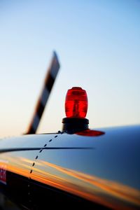 Close-up of siren on airplane against clear blue sky