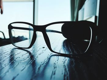 Close-up of eyeglasses on table