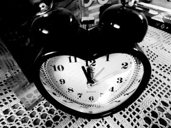 High angle view of clock on table