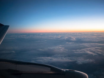Airplane wing against sky