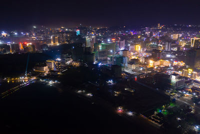 High angle view of illuminated city buildings at night