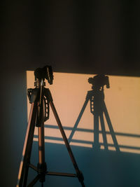 Silhouette of ferris wheel against sky