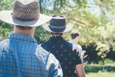 Rear view of a man wearing hat