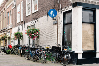 Bicycles parked by building in city