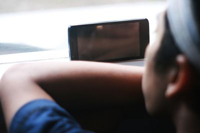 Close-up of man using mobile phone