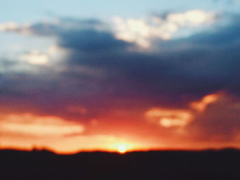 Low angle view of dramatic sky during sunset