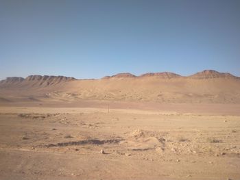 Scenic view of desert against clear sky