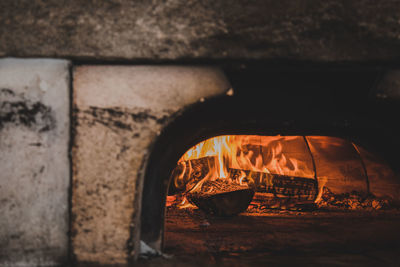 Wood burning in pizza oven