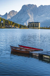 Boat in lake against mountains