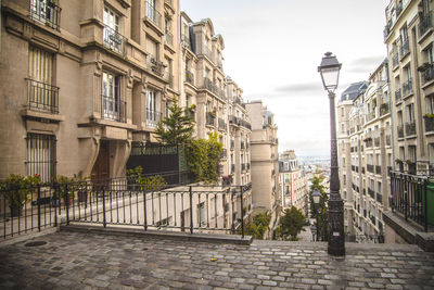 Street amidst buildings against sky