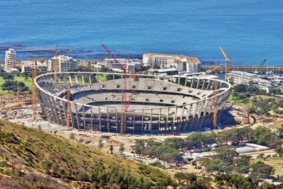 High angle view of buildings by sea