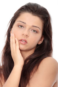 Close-up portrait of a beautiful young woman over white background