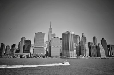 Skyscrapers in city against clear sky