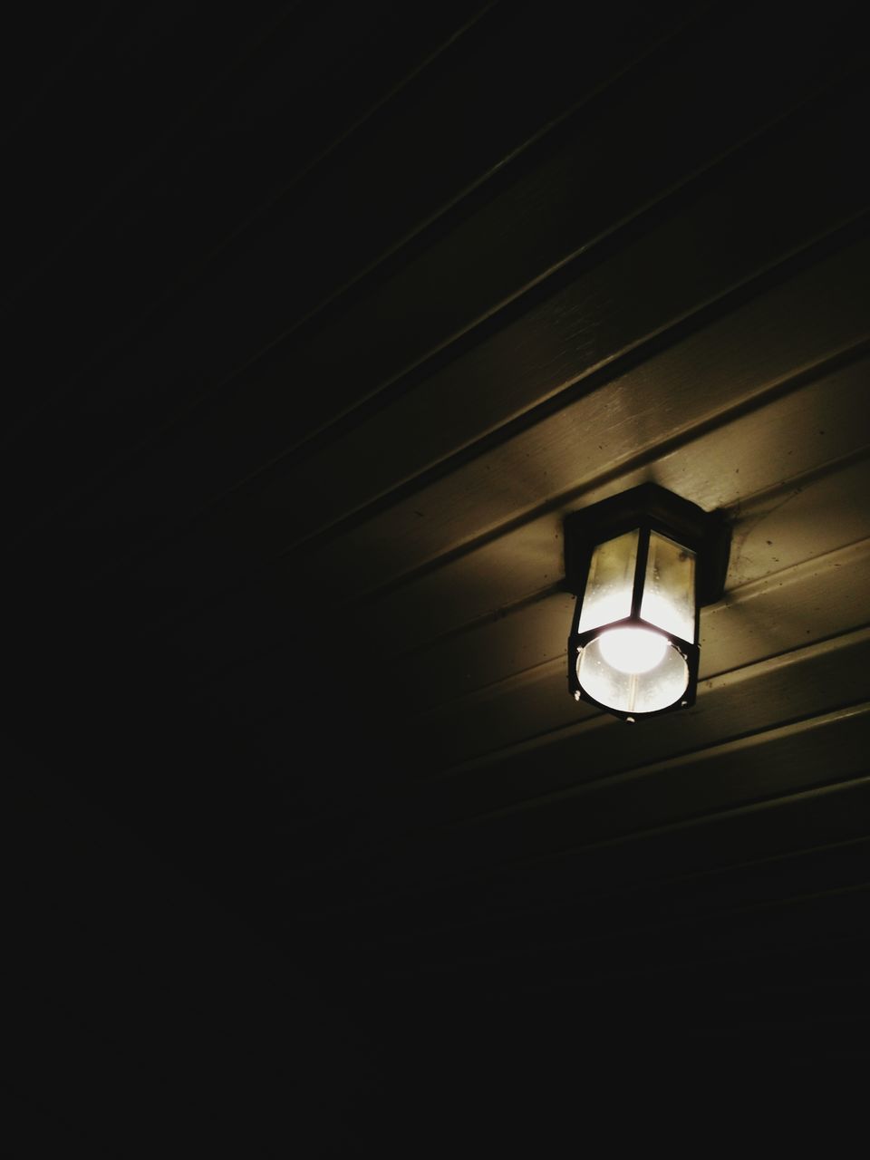 LOW ANGLE VIEW OF ILLUMINATED LIGHT BULBS