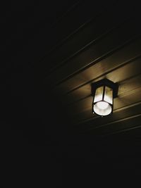 Low angle view of illuminated light bulb