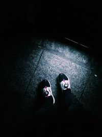 Low section of man standing on floor