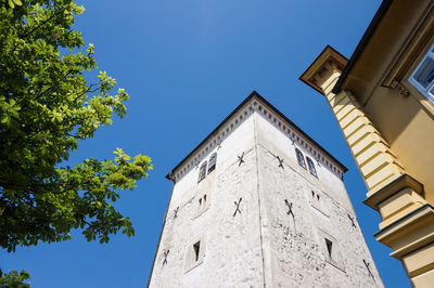 Low angle view of building against clear blue sky