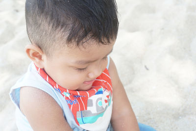 High angle view of cute boy at beach