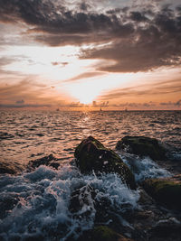 Scenic view of sea against sky during sunset