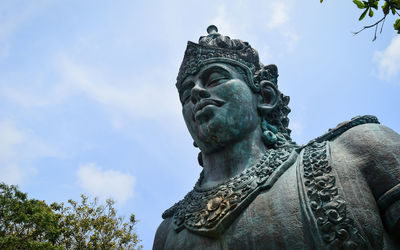 Low angle view of statue against sky