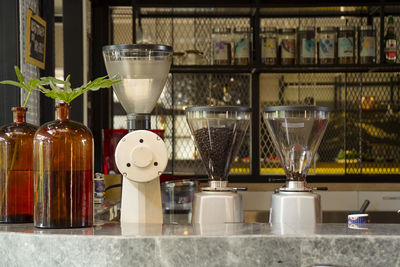 Coffee beans in blend container machine in coffee shop counter