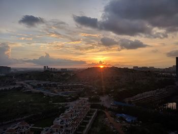 High angle view of buildings against sky during sunset
