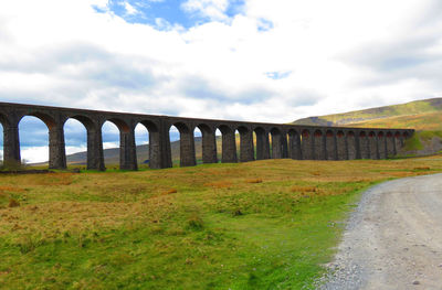 Bridge over landscape against sky