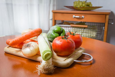 Close-up of fruits and vegetables on cutting board