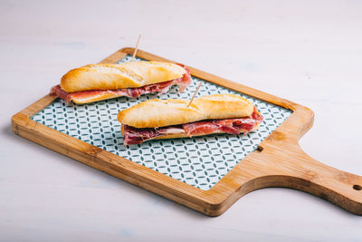 High angle view of bread on cutting board