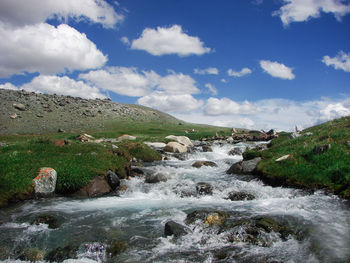 Scenic view of stream against sky